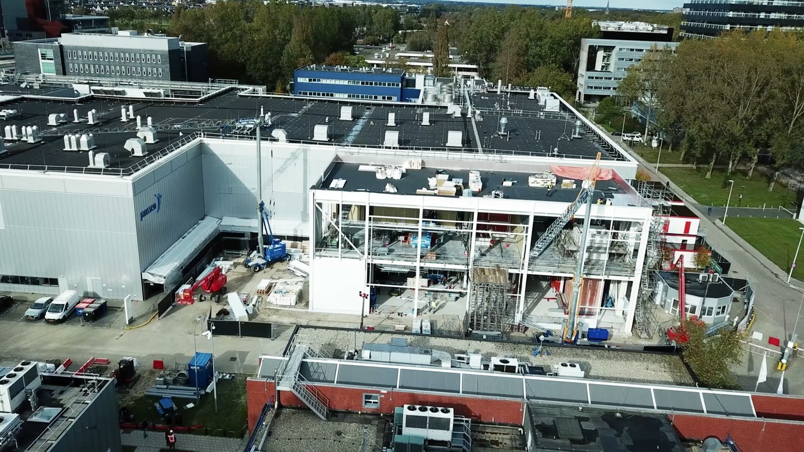 Sonic branding for pharma: an aerial view of a Janssen × Johnson & Johnson production site with a new building going up
